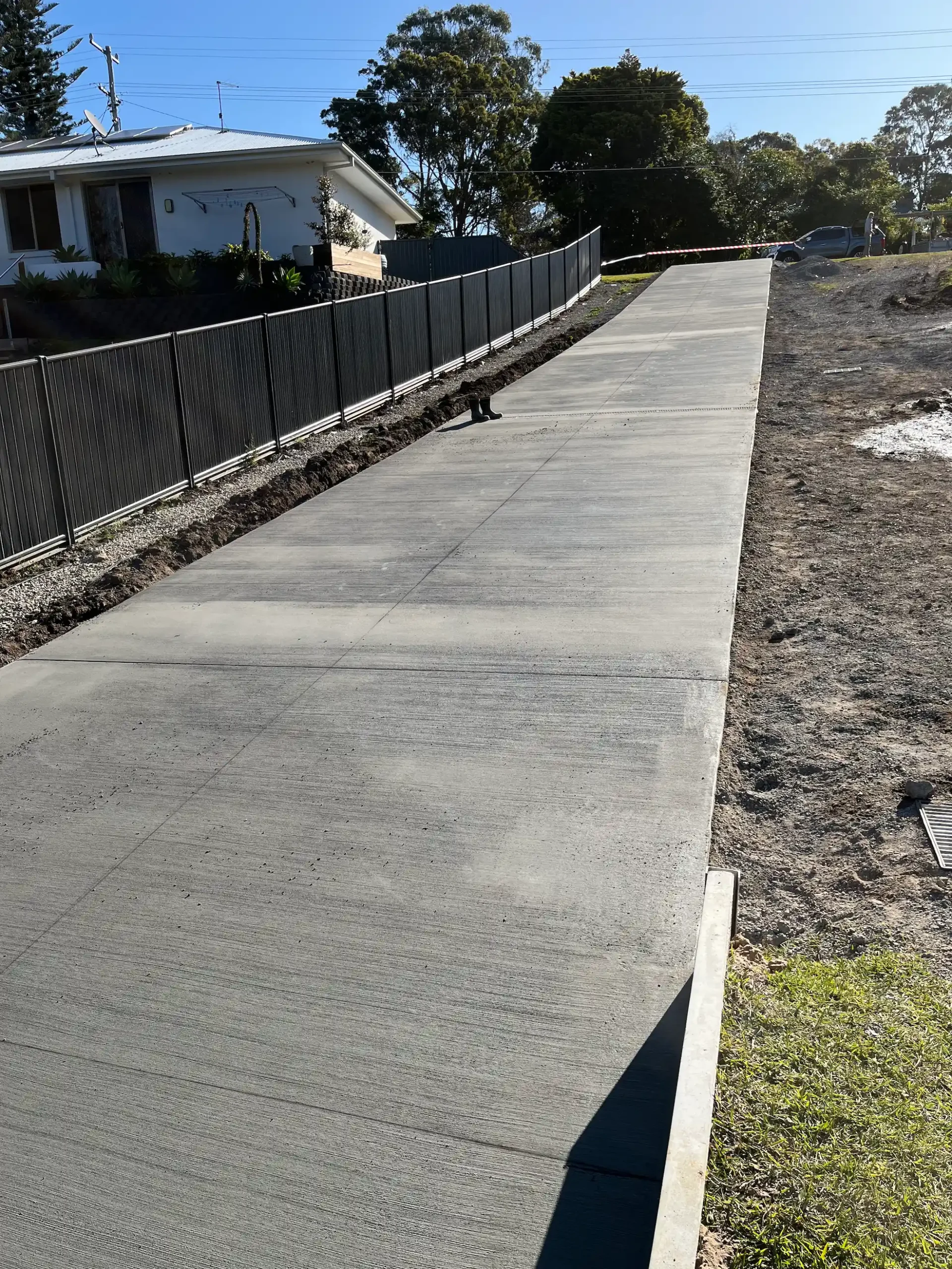 New Elanora driveway with drainage installed OSM Concrete